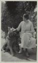 Marion Gleason with Eastman's German shepherd Herro in the garden