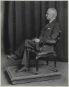 George Eastman seated in chair