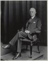 George Eastman seated in chair