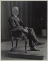George Eastman seated in chair