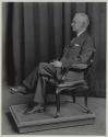 George Eastman seated in chair