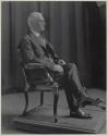 George Eastman seated in chair