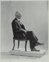 George Eastman seated in chair