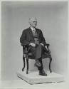 George Eastman seated in chair