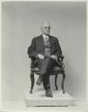 George Eastman seated in chair