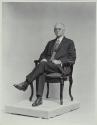George Eastman seated in chair