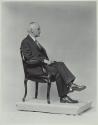 George Eastman seated in chair