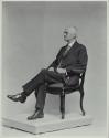 George Eastman seated in chair