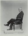 George Eastman seated in chair