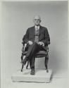 George Eastman seated in chair