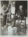 George Eastman posing for his bust