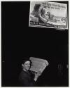 A boy in the packaging department carries a box holding a lubricant made especially for the armed forces, Pittsburgh Grease Works