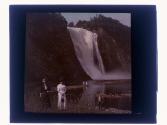 [Two women posing by falls]