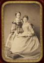 [Woman, reading, with girl]
