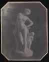 [Statue of female nude with cherub]