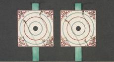 [Dart board with darts casting shadows]