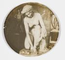 [Statue of crouching woman]