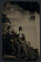 [Man and woman seated against Niagara Falls backdrop]