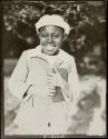 [Boy holding a book]