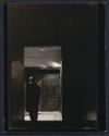 [Man in doorway]