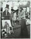 Woman photographing paintings in Paris
