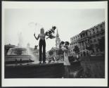 Man getting Ektasound movie camera footage of woman and pigeons beside London fountain