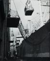 Workmen loading cargo, New York Harbor, New York