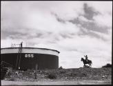 Gene Tomberlin waves to one of the station's oilers, West Texas, Texas