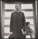 Julius Rowe, preacher and porter in Esso laboratory, and child, Baton Rouge, Louisiana