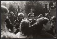 Priest with a bandage on his forehead tries to keep protesters in order and lead a sit-down strike, Londonderry, Northern Ireland