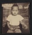 [Photo booth portrait of a young girl]