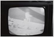 [TV showing Apollo 16 broadcast]