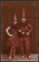 [Two women in costumes]