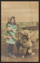 [Dog and girl with umbrella]