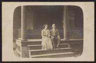 [Couple seated on steps]