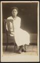 [Seated girl]