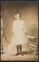 [Girl holding parasol]
