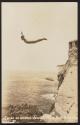 [Person diving off of a cliff]