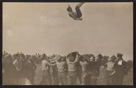 [Parachute toss]