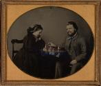 [Man and woman playing chess]