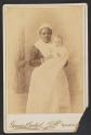 [Woman holding baby]