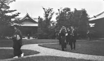 People in garden-man folding camera, Japan Trip