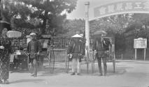 Citystreet-rickshaws in front of garden gate, Japan Trip