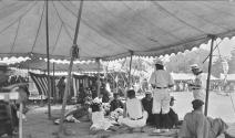Group of men sitting under canopies, Japan Trip