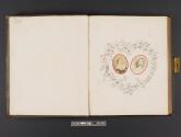 [Man and woman framed by heart-shaped floral design]