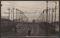 [Train and electric poles]