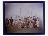 [Group posed on dock]