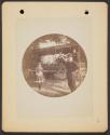 [Men and girl with wagon]