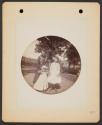 [Woman and two girls in yard]
