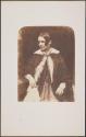 [Seated woman]